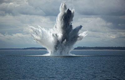 Huge water fountain caused by a below surface explosion of a sea mine