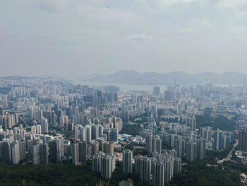 Aerial view of cityscape against sky