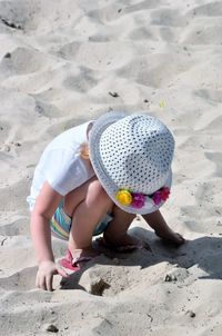 Full length of woman standing on beach