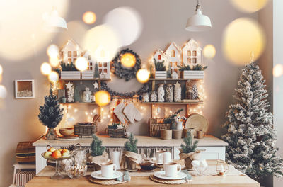 Illuminated christmas decorations on table