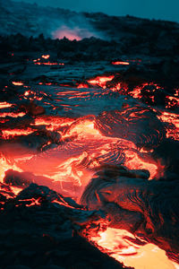 Atmospheric view of flowing lava at volcano eruption site in geldingadalir, iceland, june 2021