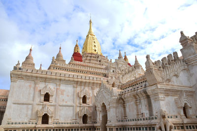 A corner of ananda pagoda's exterior under the sunlight of a cloudy day in bagan, myanmar	