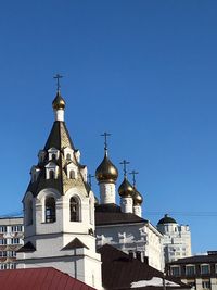 Low angle view of building against blue sky