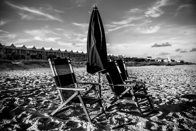 View of beach against cloudy sky