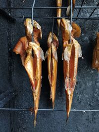 High angle view of meat hanging on barbecue