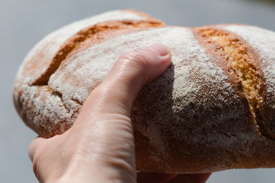 Close-up of hand holding bread