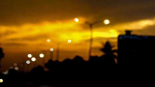 Defocused image of illuminated lights at night