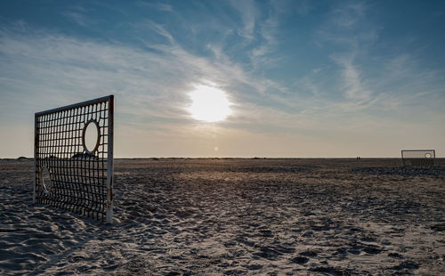 Scenic view of beach against sky during sunset