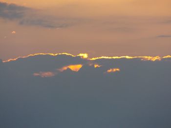 Low angle view of cloudy sky at sunset