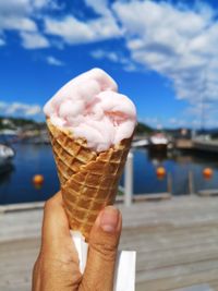 Cropped image of hand holding ice cream cone