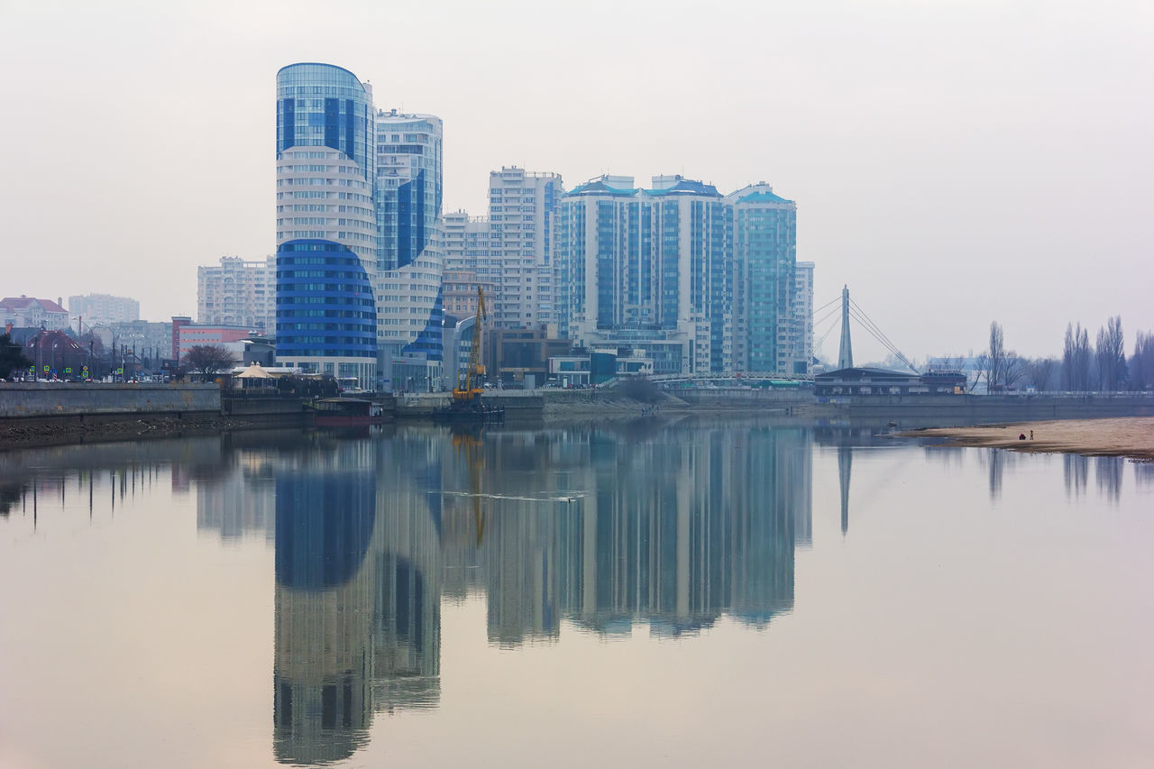 REFLECTION OF BUILDINGS ON RIVER