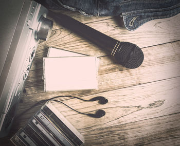 High angle view of piano keys on wooden table