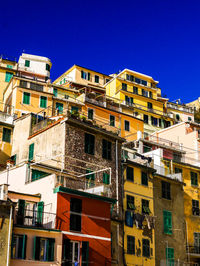 Low angle view of buildings against blue sky