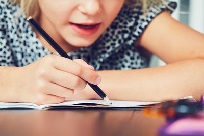 Close-up of girl with hands