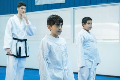 Portrait of taekwondo teacher and students