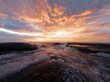 Scenic view of sea against sky during sunset