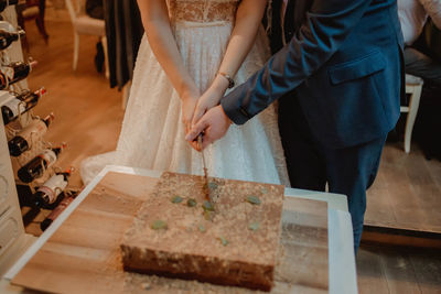 High angle view of woman standing on table