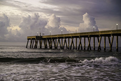 Pier over sea against sky