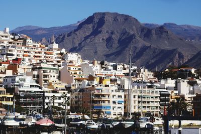 Houses in town against clear sky