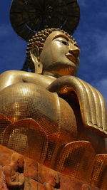 Low angle view of statue against sky