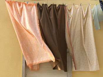 Clothes drying on clothesline at home