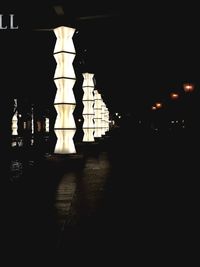 Illuminated temple against sky at night