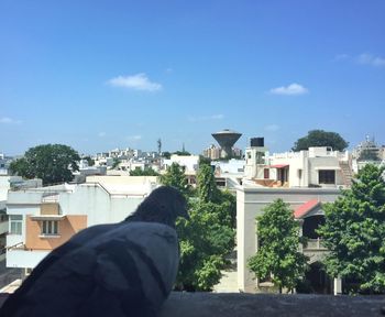 View of town in front of blue sky