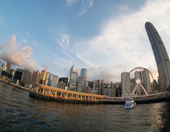 Panoramic view of river and buildings against sky