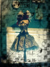 Digital composite image of woman with arms raised