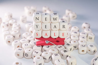 Close-up of text with clothespin on blocks over table