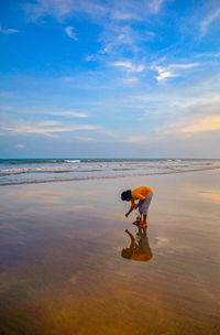 A perfect holiday at the beach enjoying sunset, collecting shells