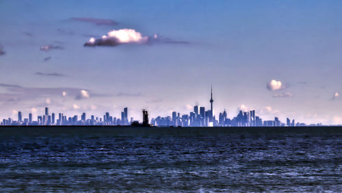 View of buildings in city at sunset