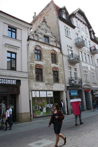 Man standing in front of building