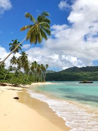 View of beach against cloudy sky