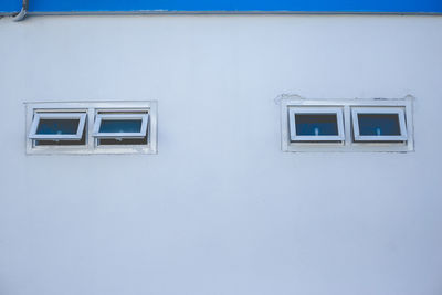Close-up of window on white wall