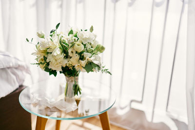 Midsection of woman with bouquet