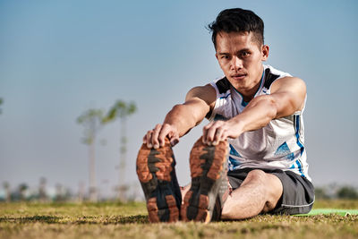 Portrait of man on field against sky