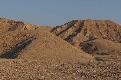 Scenic view of desert against clear sky