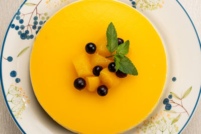 High angle view of cheesecake in plate on table