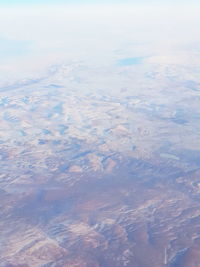 Aerial view of cloudscape over landscape
