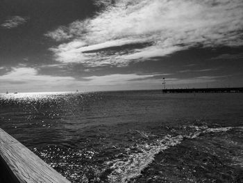 Scenic view of sea against cloudy sky