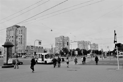 People in city against sky