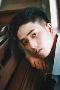 Close-up portrait of young man on piano