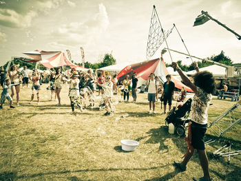 People on field against sky