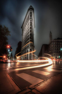 Low angle view of illuminated city at night