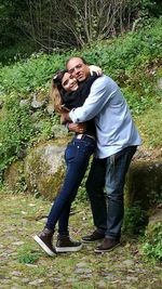 Young couple standing in forest