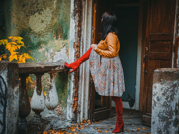 Rear view of person standing in front of entrance