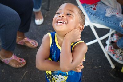 Close-up portrait of smiling girl standing outdoors