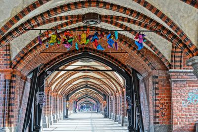 Shoes hanging in historic tunnel