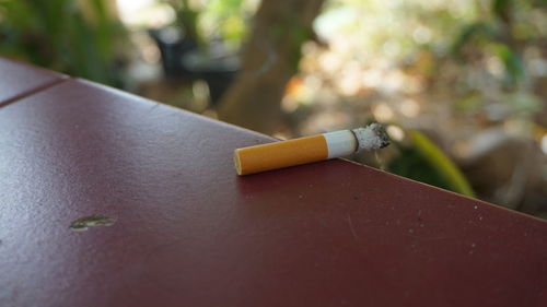 Close-up of cigarette smoking outdoors